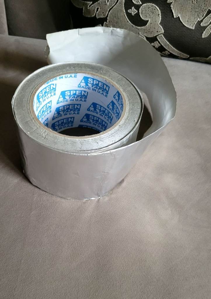 Roll of adhesive silver foil tape for air conditioning etc