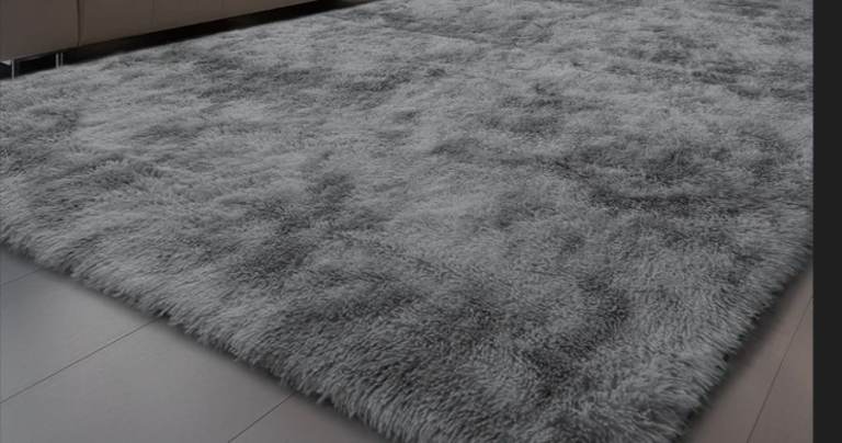 image for A new still packed 2 tone fluffy grey rug the measurements are 290cms x 200cms .