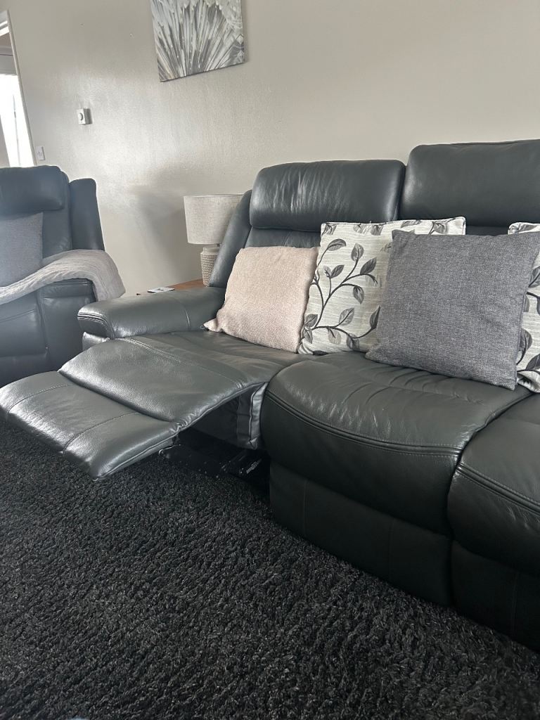 Italian grey leather reclining sofa and two chairs 
