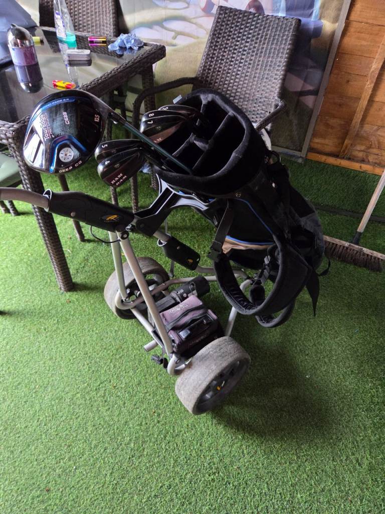 Irons,driver,bag and trolley 