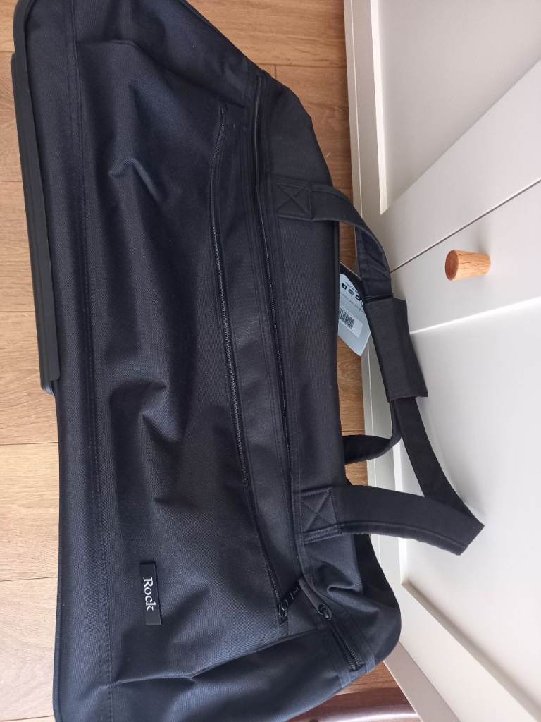 Rock wheeled suitcase brand new.