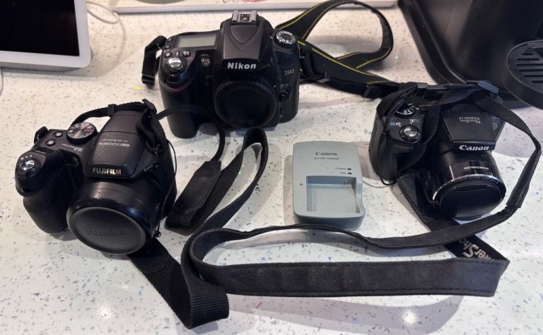 Nikon D90 DSLR, Fujifilm, and Canon Digital Cameras with Charger