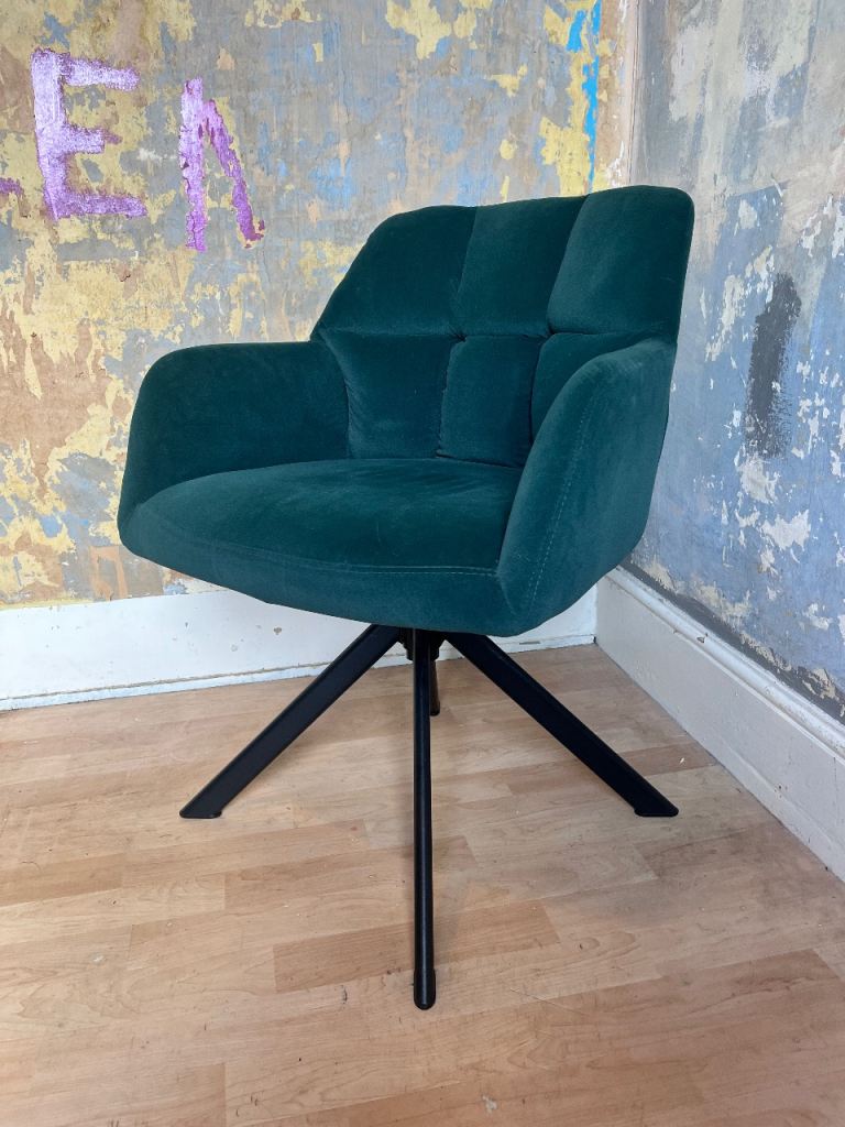 Dark green velvet swivel armchair 