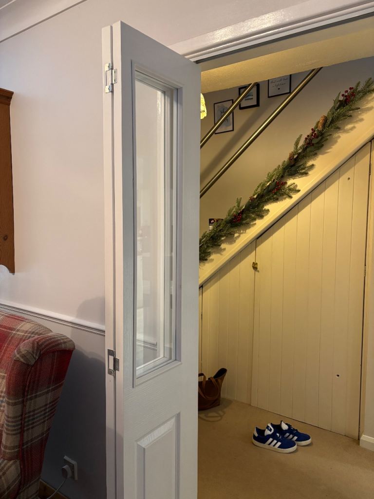 Unused White bi-fold half glazed door. (1 Trim damaged ) 