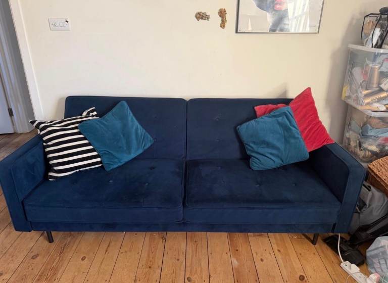 Sofa couch with a fold out bed. 