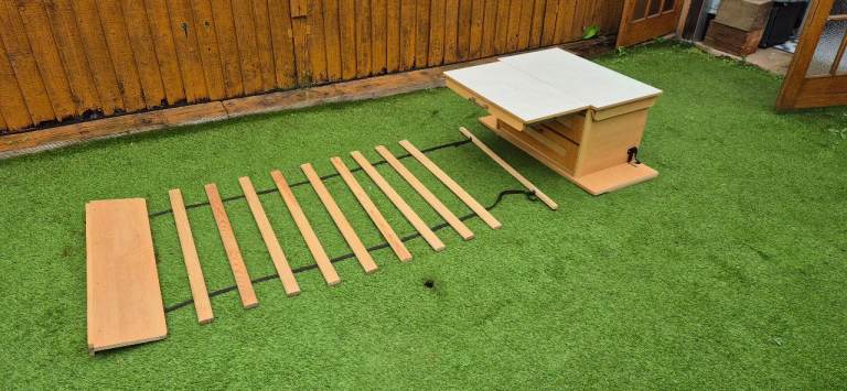 Centre drawer with folding table and bed slats.