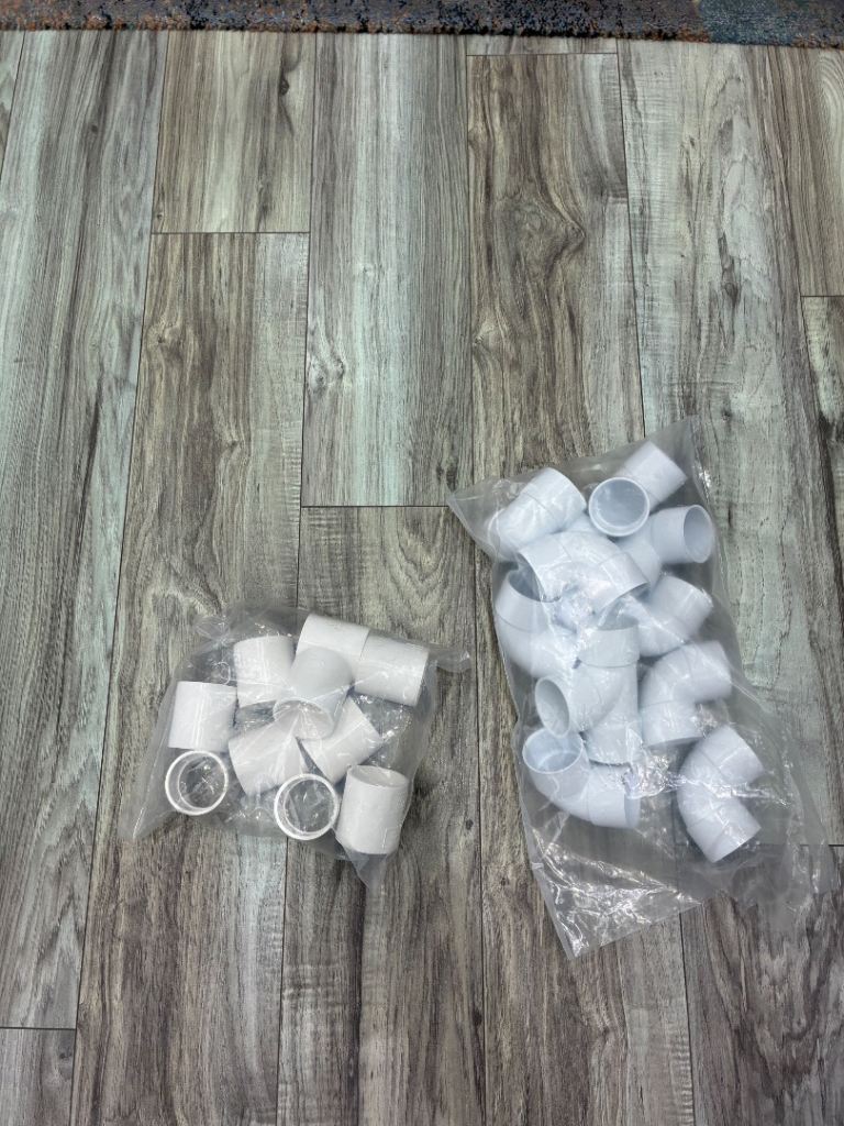 White Plastic PVC Pipe Fittings – Couplings & 90-Degree Elbows