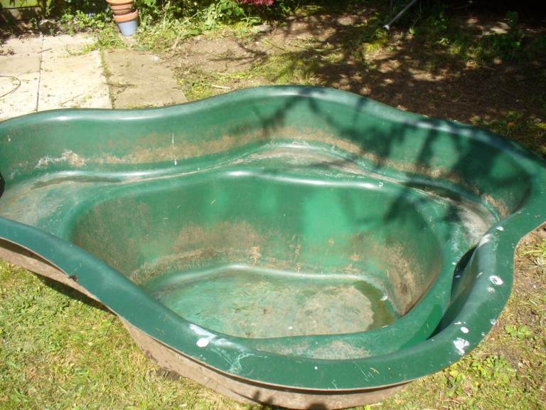 Fiberglass fishpond with pump and filter box