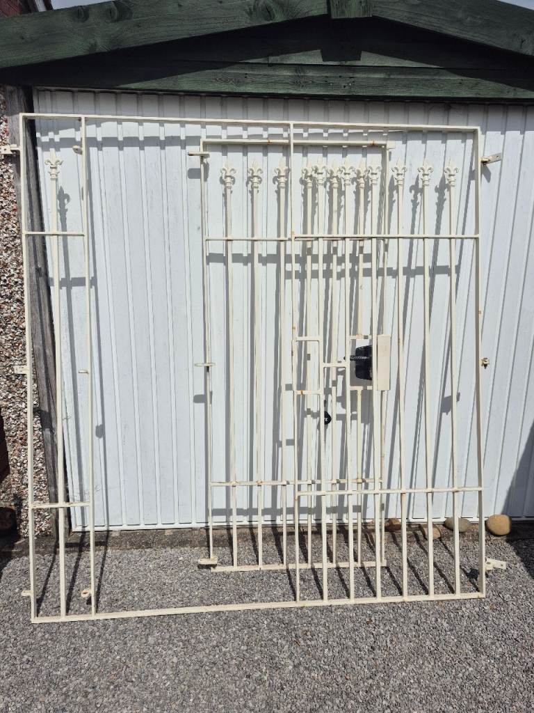 Painted lockable gate and it's surrounding frame plus another matching section.