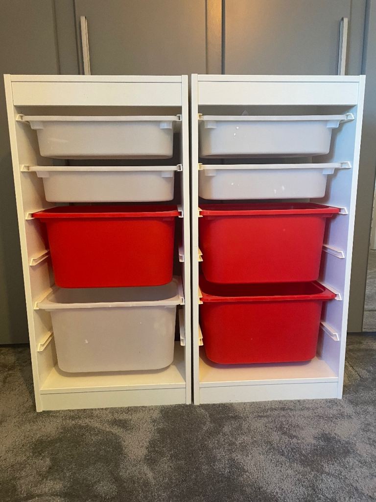 IKEA box shelves. White shelves with red and white boxes. 