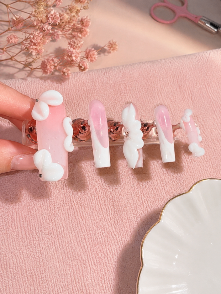 3d flowers with a white French tip and a glossy top 