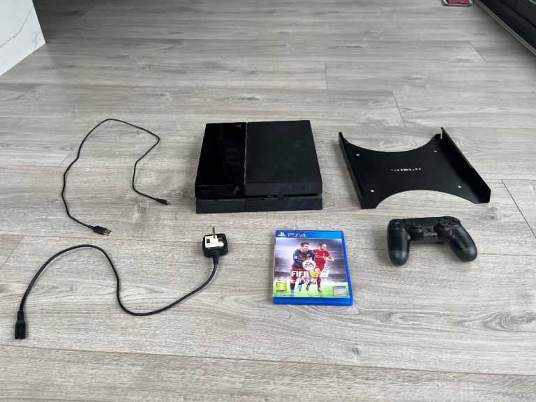 PS4 console with controller and game