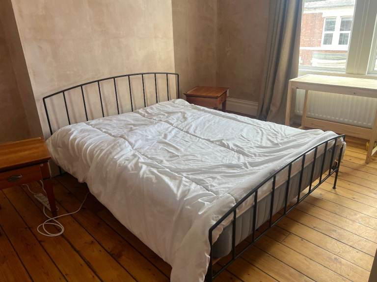 FREE King sized black metal bed frame with wooden slats. Comes with comfy Ikea mattress