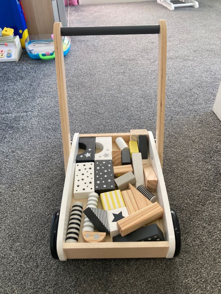 Push along wooden trolley 