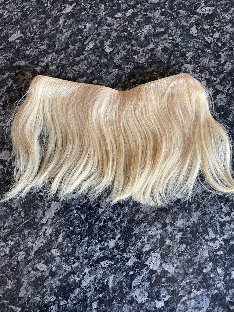 Blonde human hair flip in hair extension on an invisible wire
