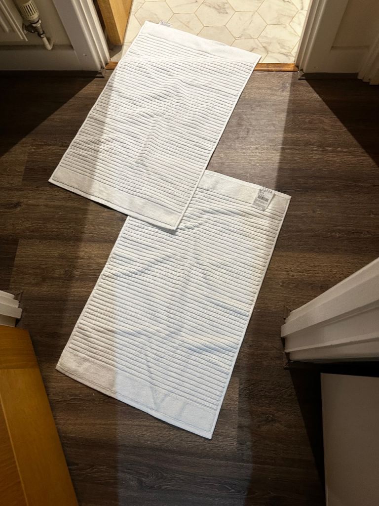 Pair of White Striped Bath Mats - Good Condition