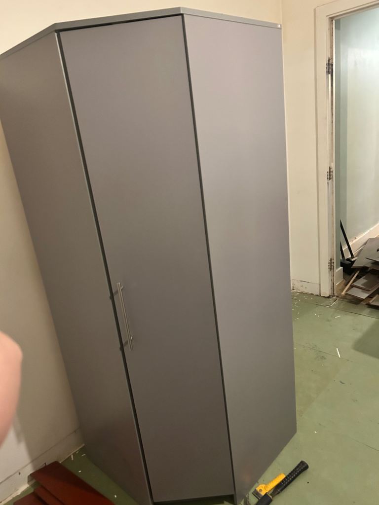 2 grey corner wardrobes with shelving and 2 hanging bars