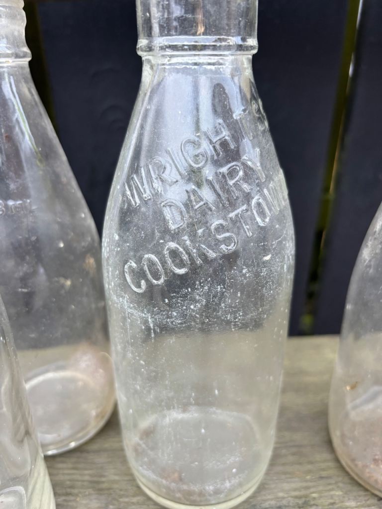 9 old glass milk bottles 