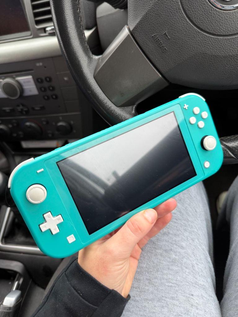 Nintendo Switch Lite Turquoise with 128GB Micro SD Card – As Good As New
