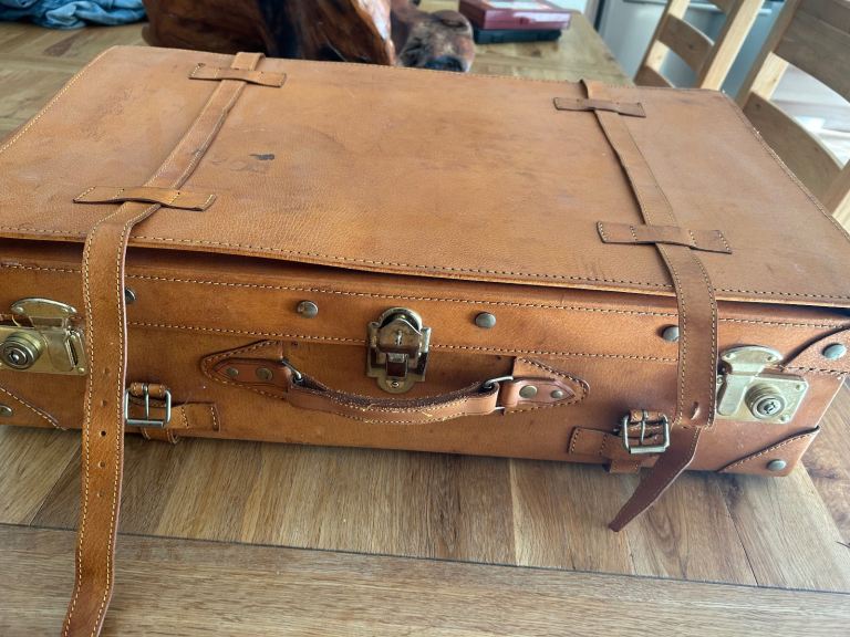 Leather suitcase in great condition hardly used with locks and straps