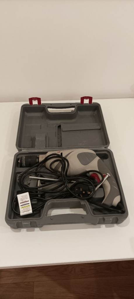 Performance PHD710 corded hammer drill and original case.