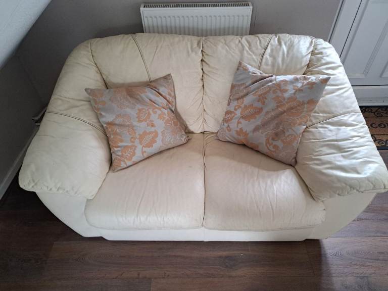 2 SEATER CREAM LEATHER SOFA