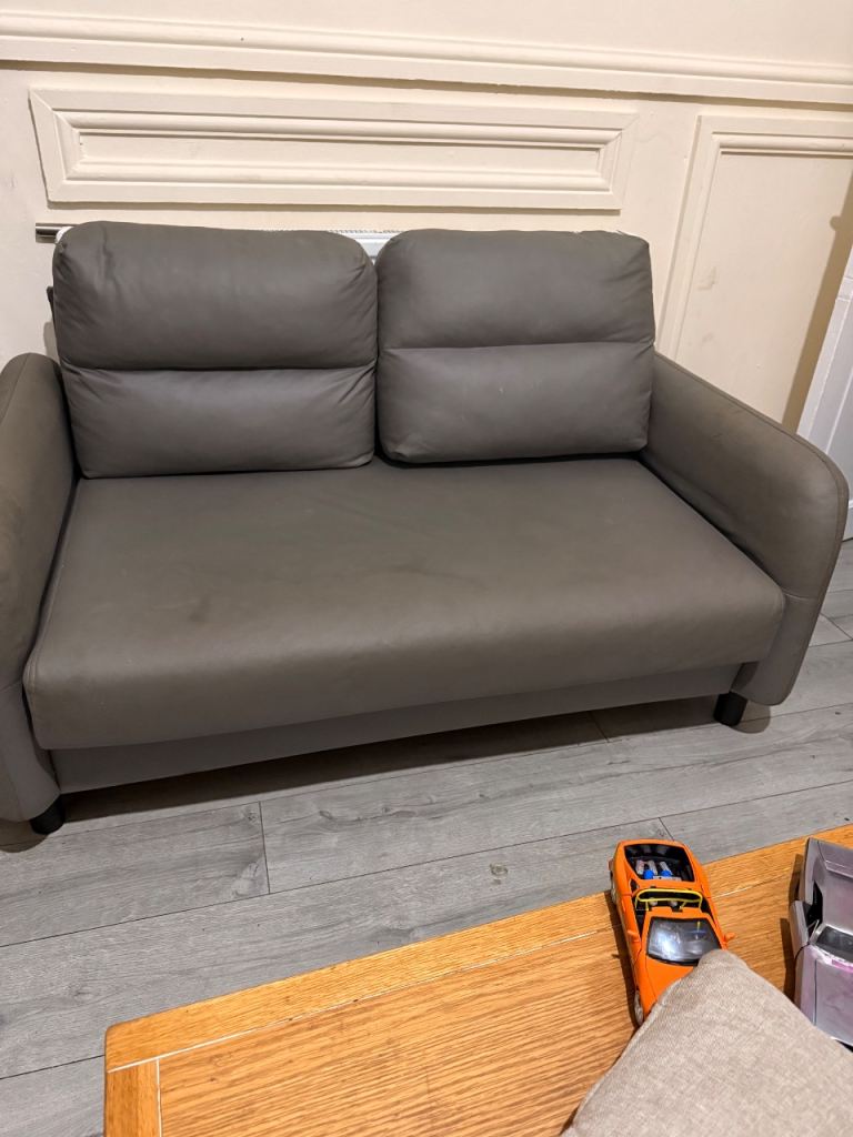 Grey Two-Seater Sofa Bed – Good Condition