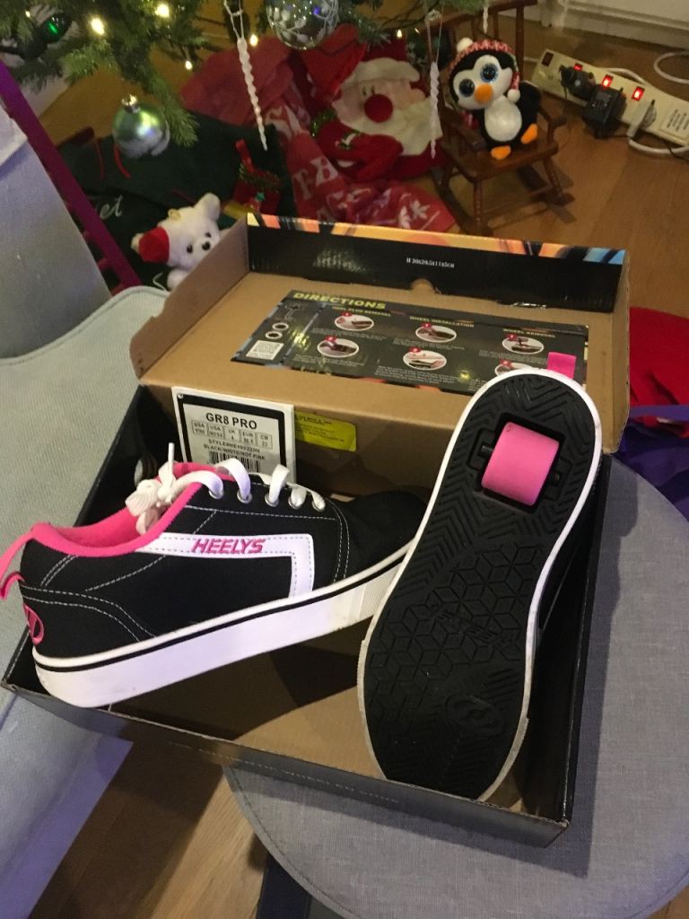 Pair of Heelys UK size 4 - still in original box cost £55  Unused present.