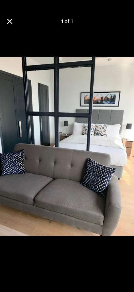 Grey Fabric Two-Seater Sofa – Good Condition