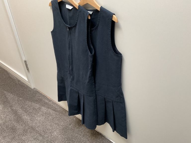 2  navy pinafore dresses 9-10 years
