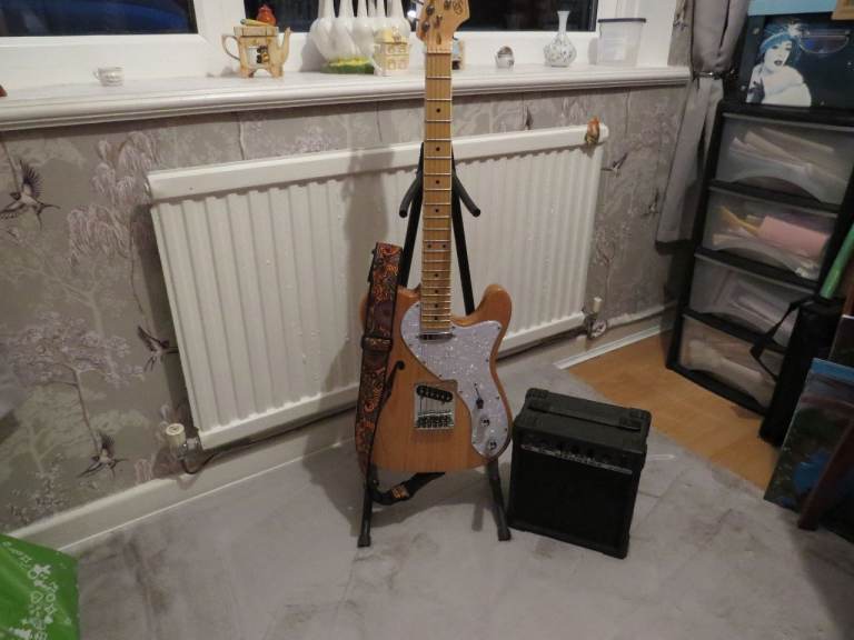 SX electric guitar with amp.