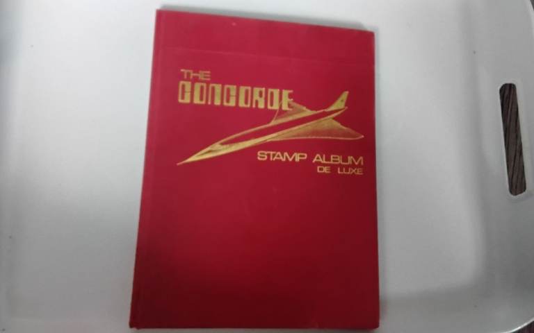 The concorde stamp album & some stamps inside 