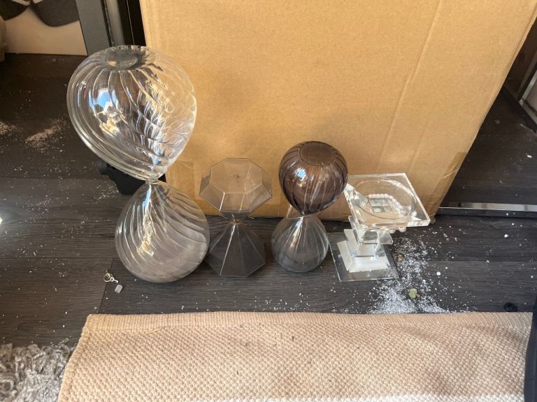 Selection of hour glasses and candle stick 