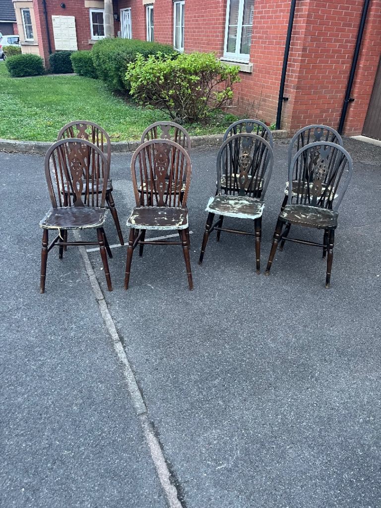 Eight wheel back dining chairs (delivery available)