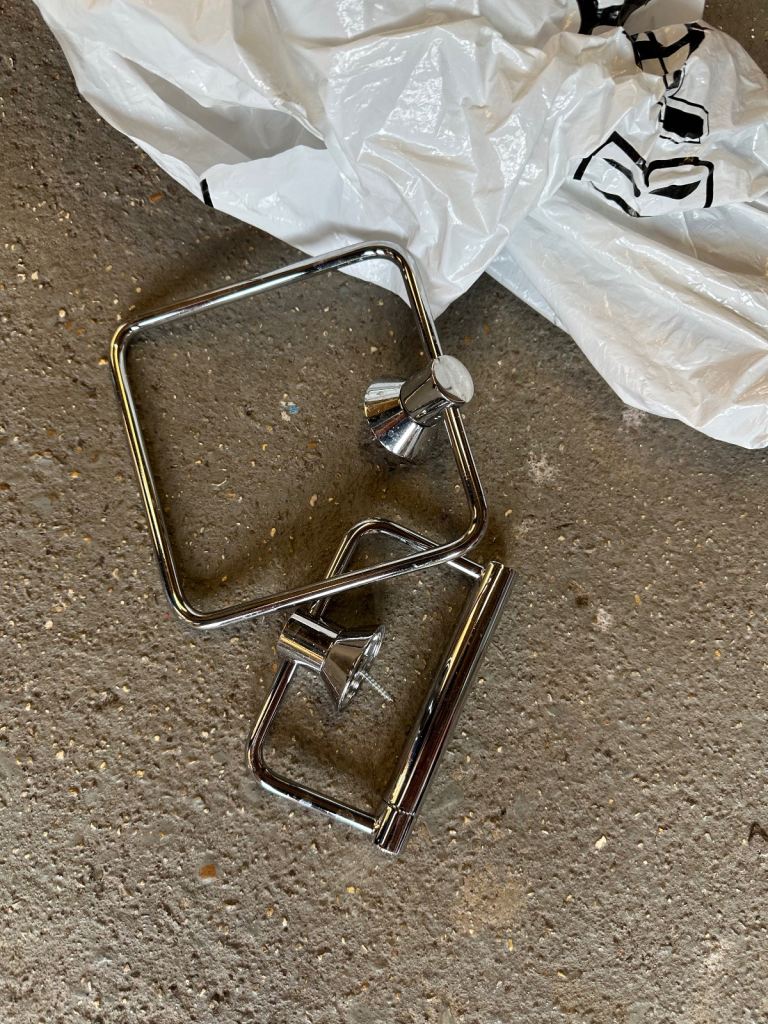 Bathroom silver towel and toilet hanging