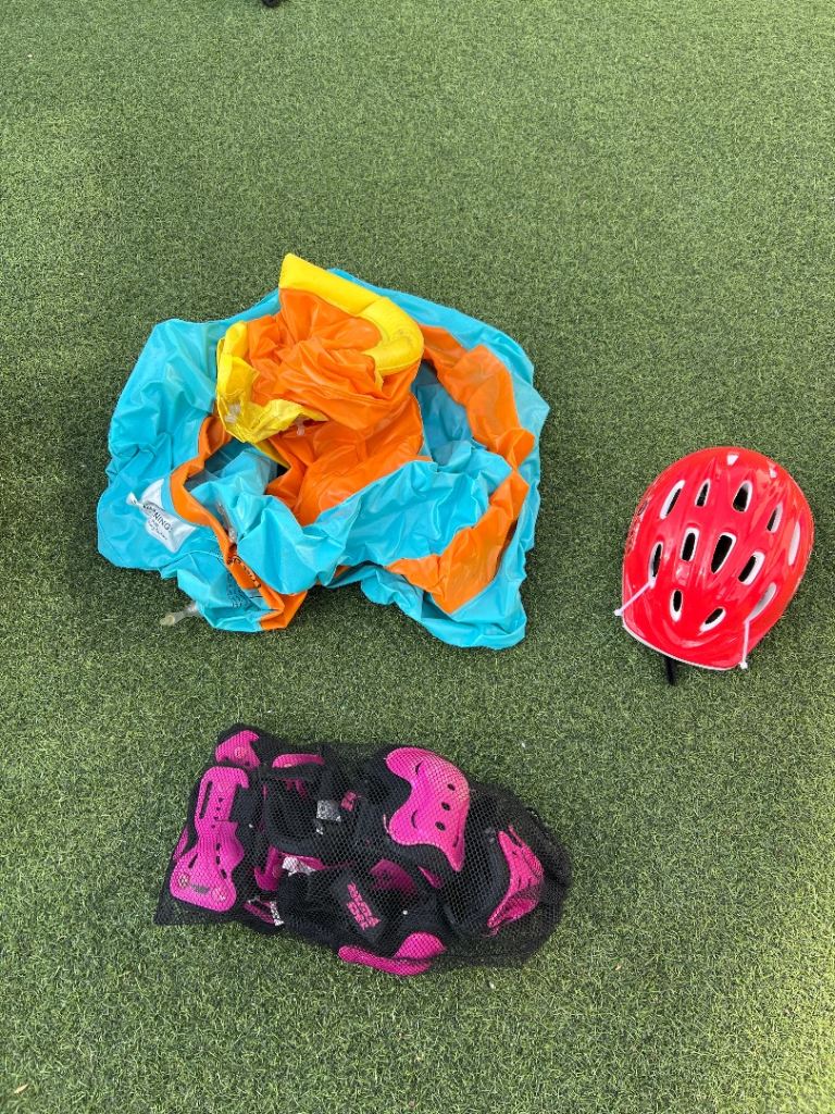 Baby pool, bike helmet and girls pads