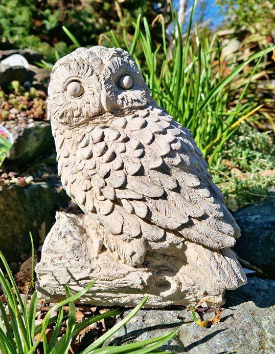 Owl on a log garden statue