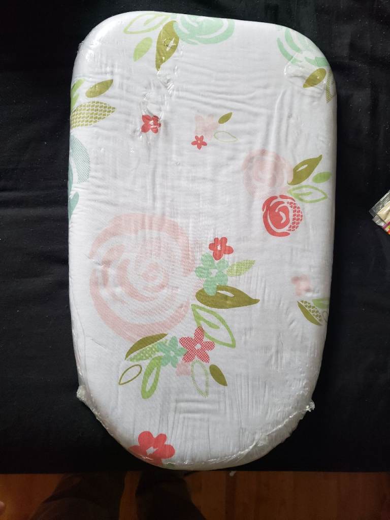 This is an Amazon Basics tabletop ironing board with a floral pattern. 