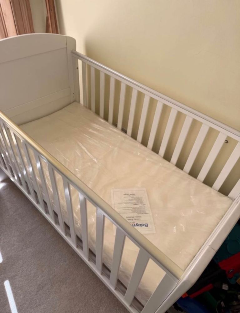 Well proportioned cot, brand new with unopened mattress