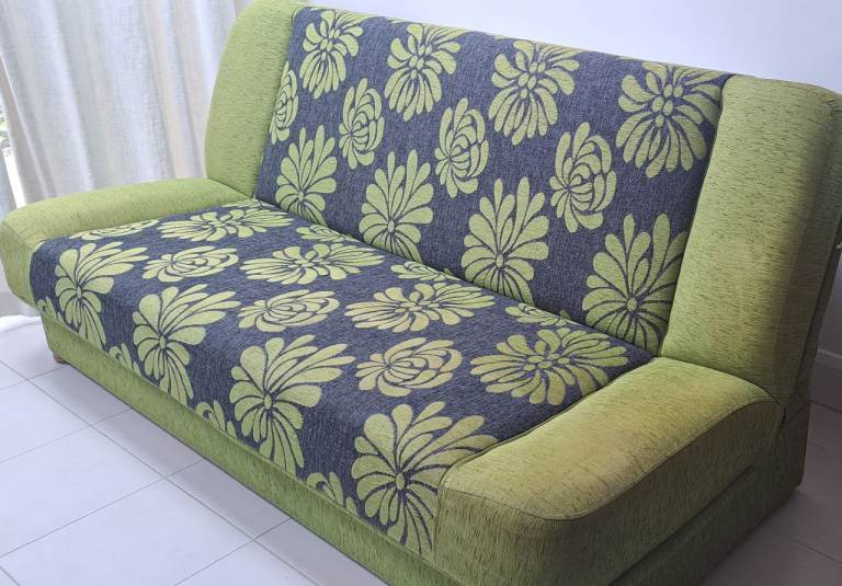 Three -Seater Retractable Sofa with the storage box in Green and Floral Pattern – Good Condition