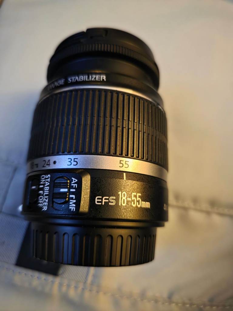 2 canon cameras with loads of accessories.