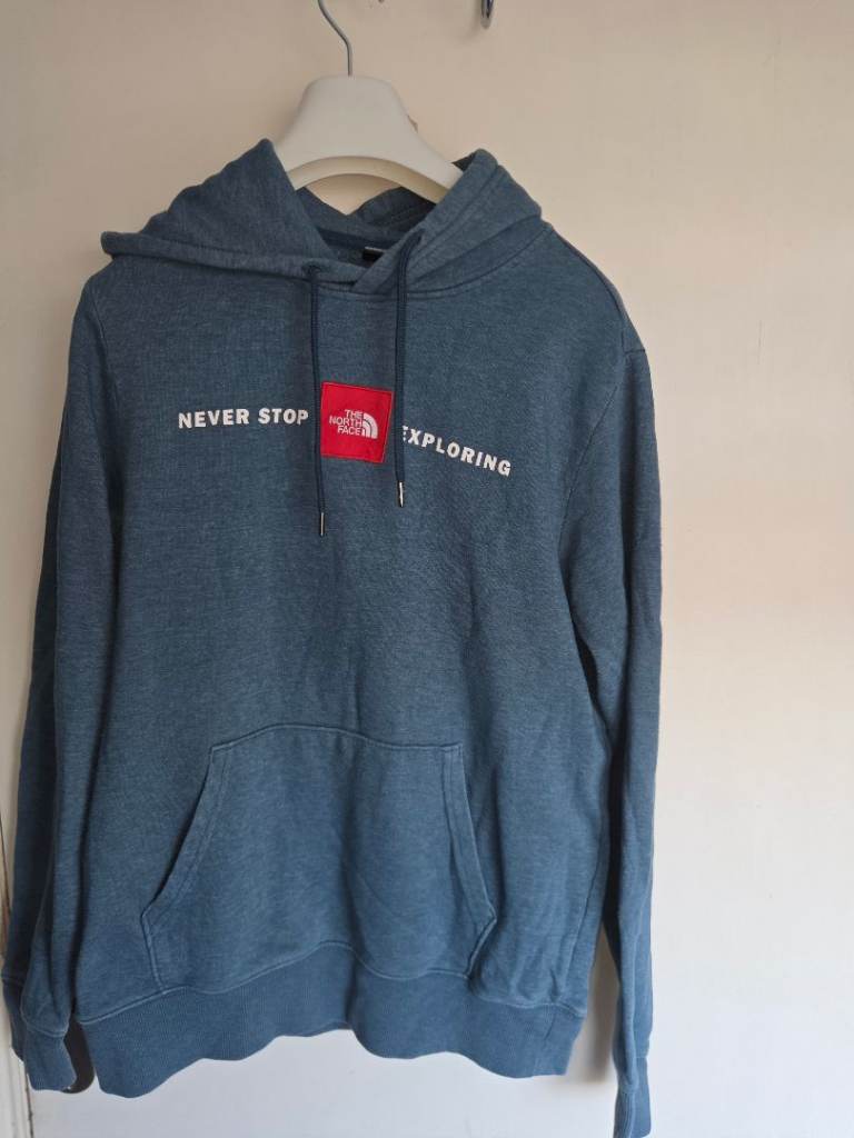 The North Face "Never Stop Exploring" Red Box Logo Hoodie – Blue Marl