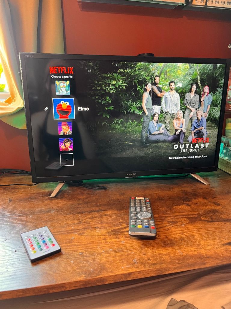 Sharp aquos Smart tv with dvd player in the back 