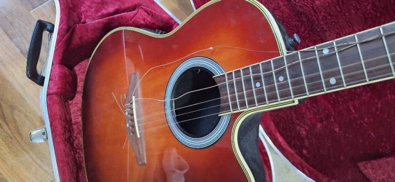 Electric/acoustic guitar, model AE138. Approx 20 years old. with hard case