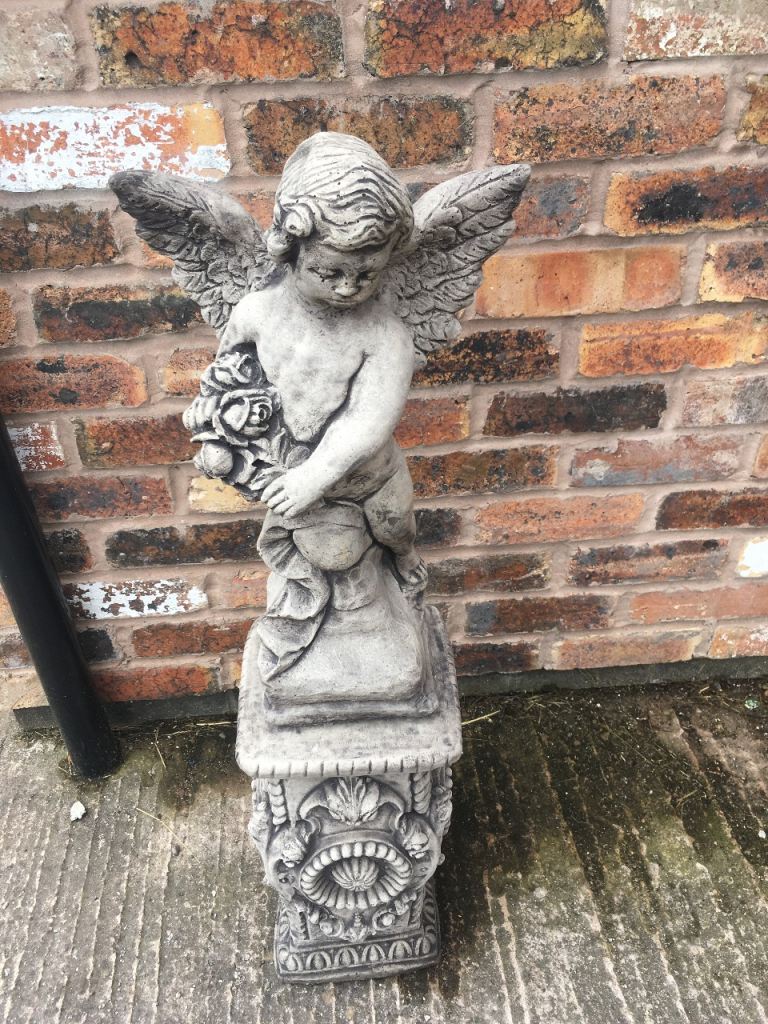 Angel on plinth