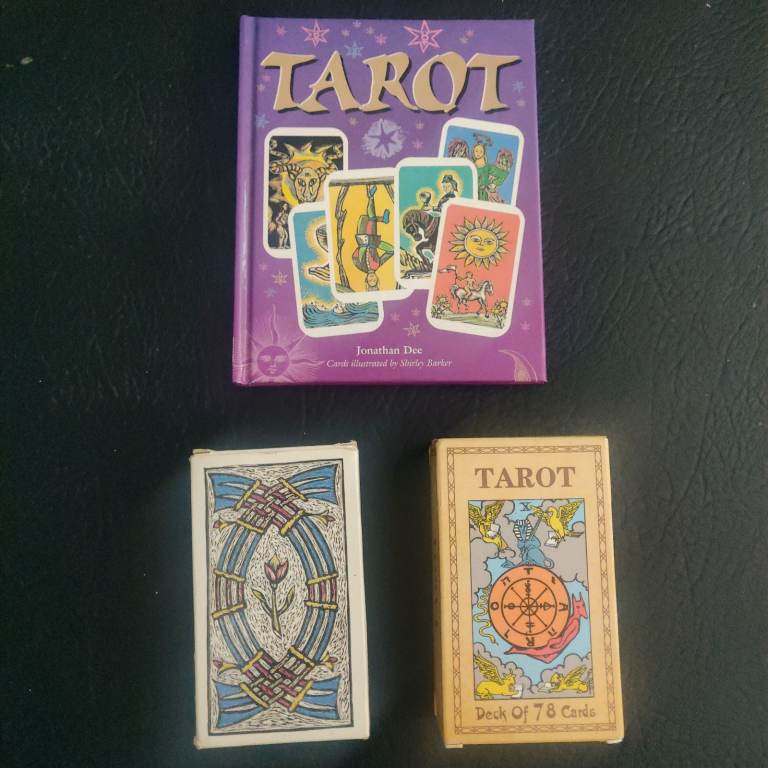  2 sets of Tarot cards and book explaining readings