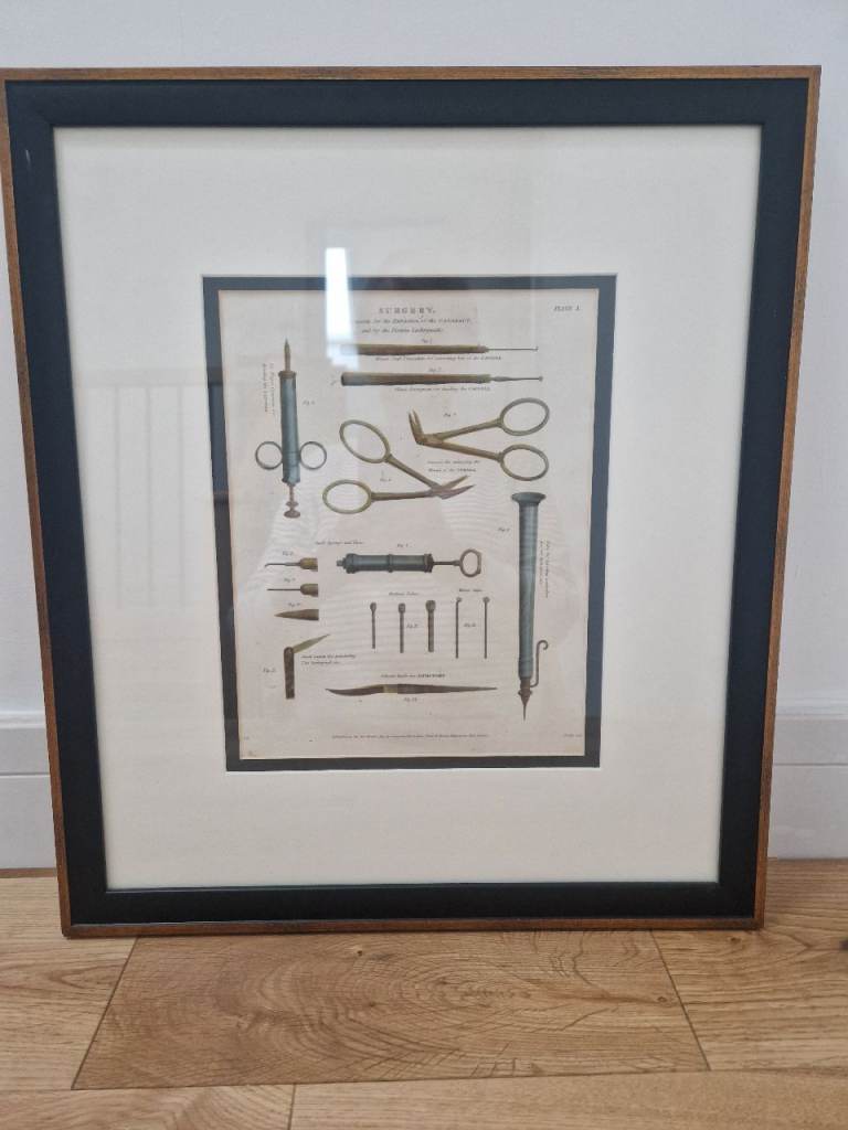Framed print showing surgical instruments