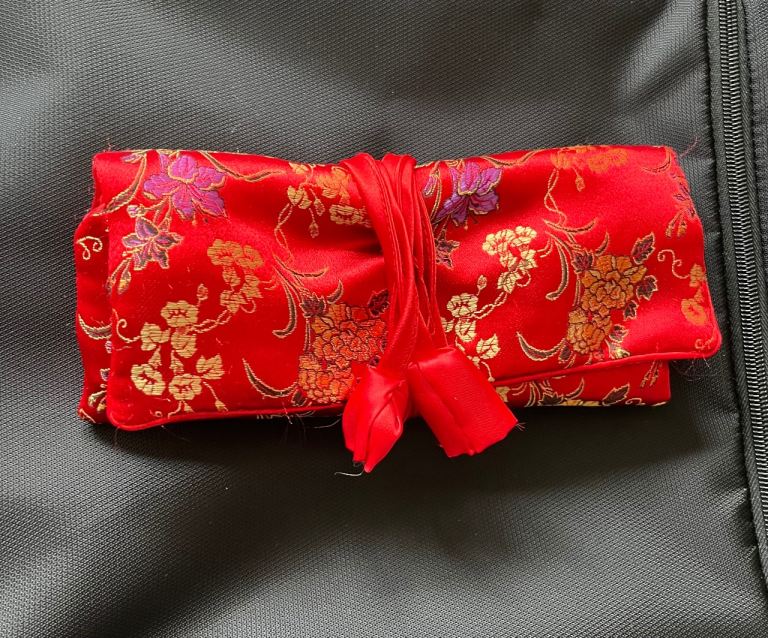 Silk jewellery roll, bought in Singapore . Excellent storage for jewellery 
