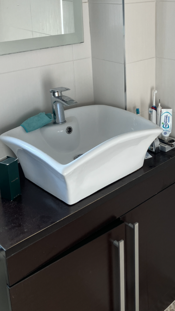 Counter top sink with tap and pop up plug