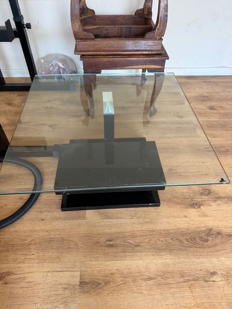Modern Glass Coffee Table with Black Base – Good Condition